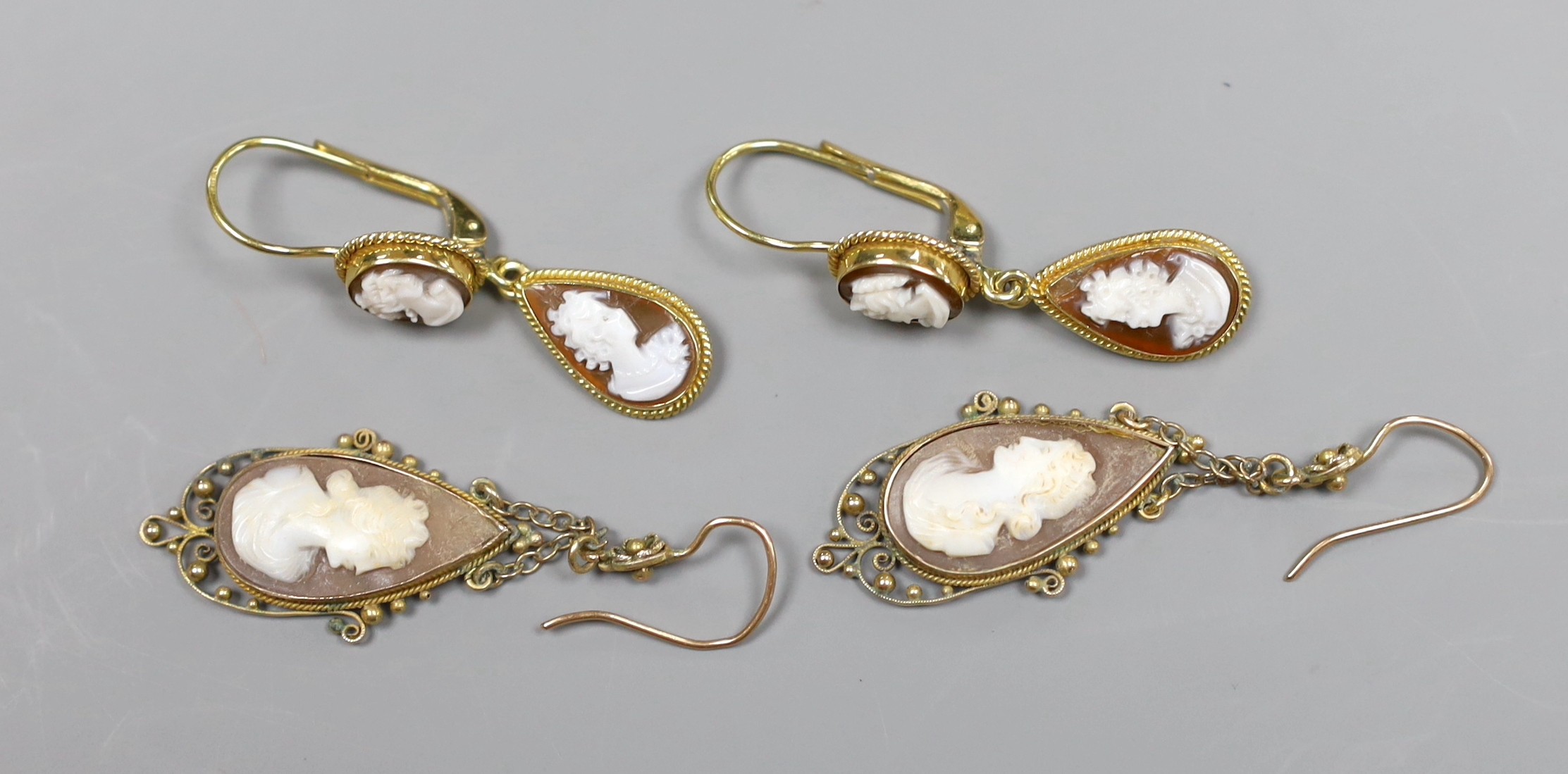 A pair of 18ct gold cameo drop earrings, 3cm and a pair of 9ct gold chain drop cameo earrings, 4.5cm